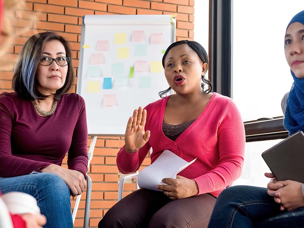 Women supporting each other during group meeting