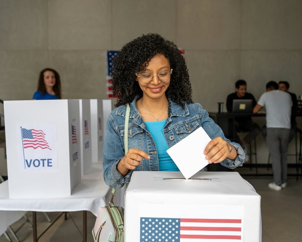 Young woman at a ballot box