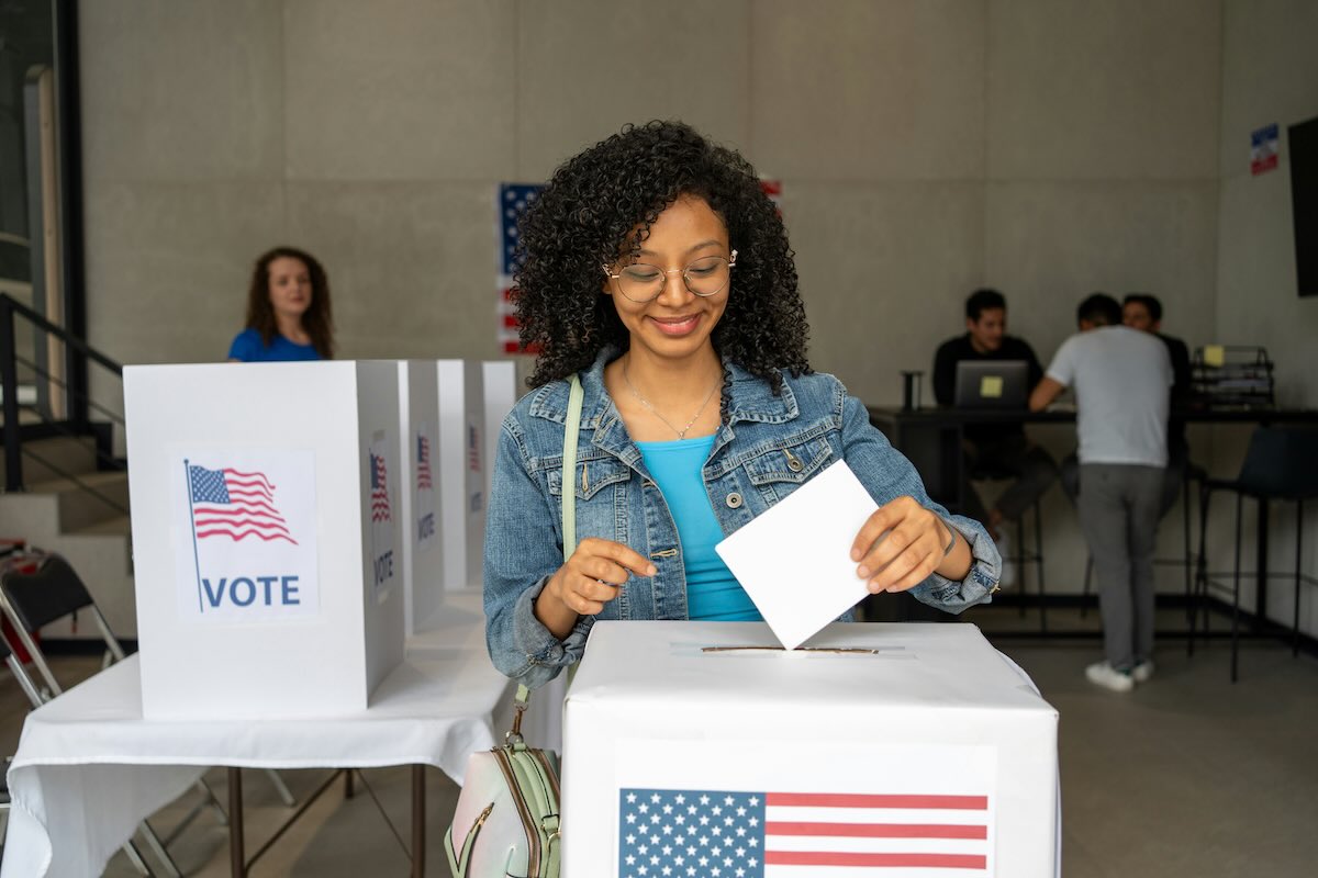 Young woman at a ballot box