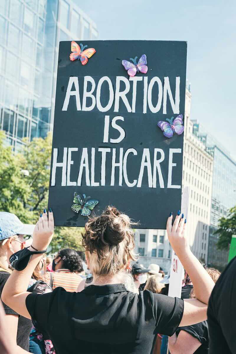 Woman holding Abortion is Healthcare sign